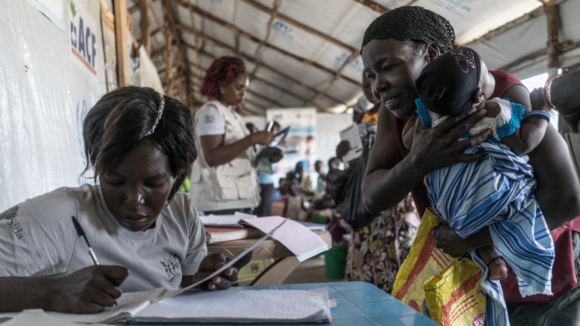 Action Against Hunger staff provide care to South Sudanese mothers and children in the Bidi Bidi Settlement in Yumbe, Northern Ugand