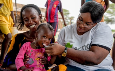 Dieymaba Niang sits while her daughter Kadia Diallo is fed ready-to-use therapeutic food to regain her health. Together, we can save lives and help children like Kadia not only survive - but thrive.