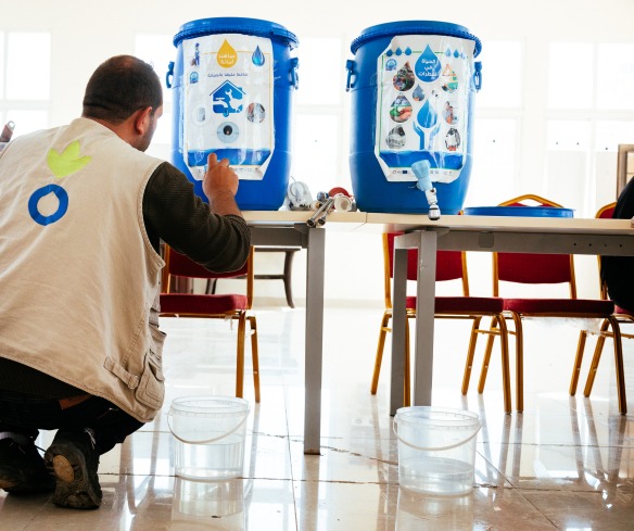 An Action Against Hunger staff member gets ready for a hygiene education session.