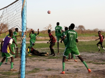 With the score tied 1-1 in extra time, players scramble to score a goal.